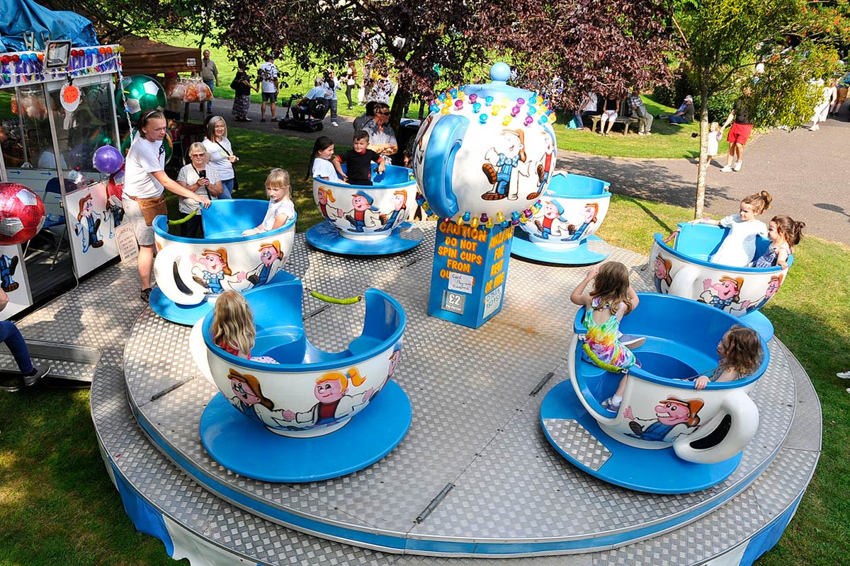 Children on spinning teacup ride at the Horsley Big Day Out